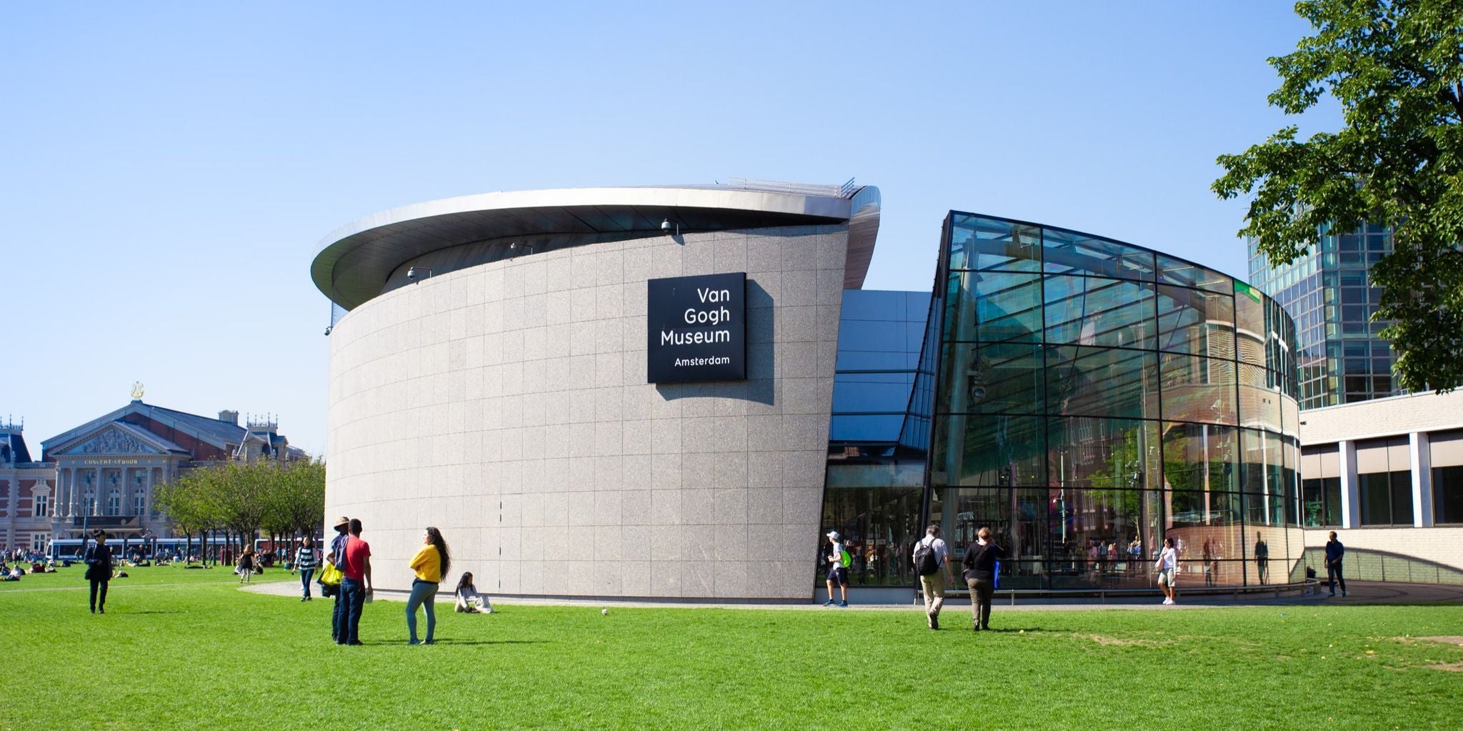 Visitors outside the Van Gogh Museum on a sunny day in Amsterdam’s Museumplein..jpg