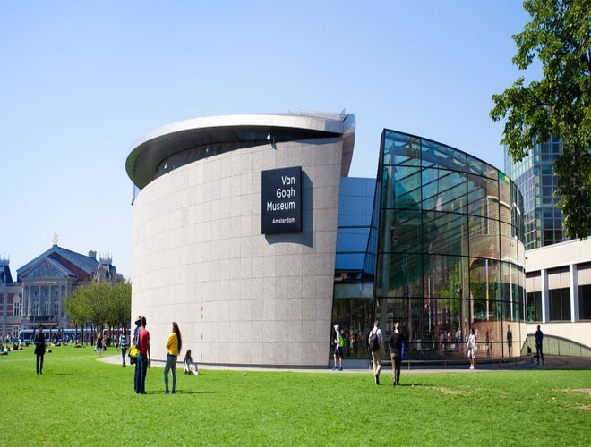 Visitors outside the Van Gogh Museum on a sunny day in Amsterdam’s Museumplein..jpg