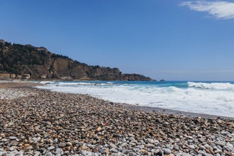 Photo of Ionian Sea coast and beautiful beach in Villagonia, Taormina city on the island of Sicily, Italy.