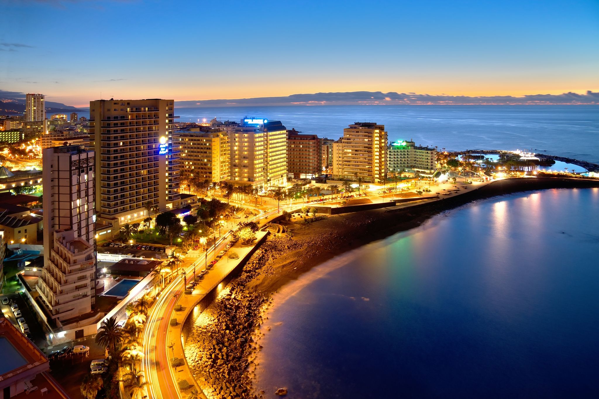 photo of hotel zone at night at Lago Martiánez in Puerto de la Cruz, Tenerife, Spain.