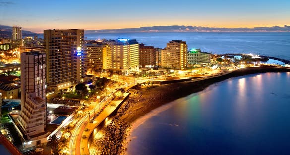 photo of hotel zone at night at Lago Martiánez in Puerto de la Cruz, Tenerife, Spain.