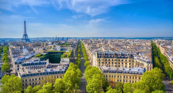 An  overview of the Eiffel Tower and Paris, France from the Arc de Triomphe.