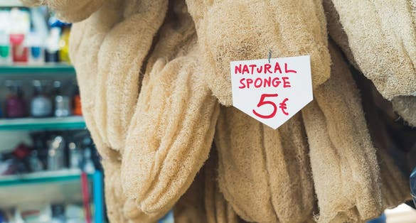 photo of Natural sponges for sale in a greek local Kapani Market. Sustainable product for sensitive skin and synthetic-free showering. High quality photo,Thessaloniki Greece.