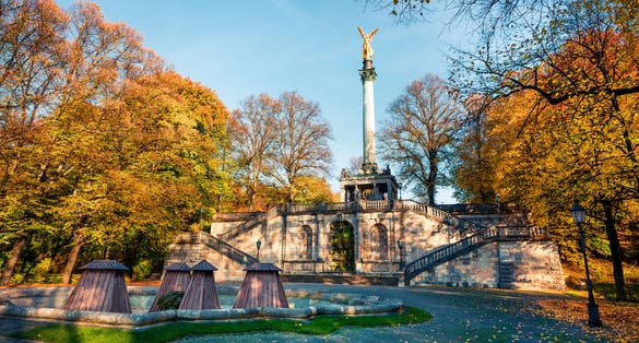 photo of view of Picturesque autumn view of Angel of Peace (Friedensengel) monument, park statue of a golden angel on a column is a monument to peace with mosaics and a viewing deck, Munich, Bavaria, Munich germany.