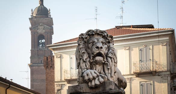 Statue of one of the two Lions placed on the pylons of the "Ponte dei Leoni", in the city center of Monza (Italy)