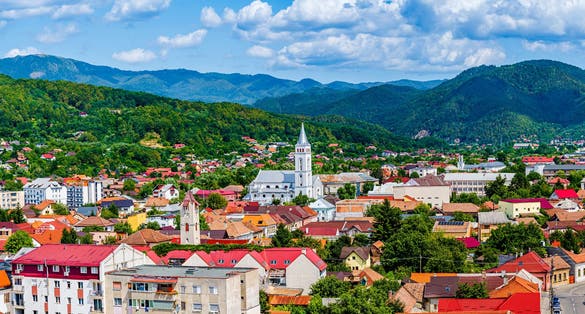 photo of view of Aerial view of Baia Mare city with roof tops and the Catholic Cathedral in Baia Mare, Maramures, Romania; Assumption of Mary Cathedral or Saint Mary, the greek-catholic cathedral in Baia Mare
