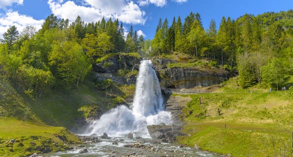 Photo of splendid summer view with popular waterfall Steinsdalsfossen on the Fosselva River, municipality of Kvam in Hordaland county, Norway.