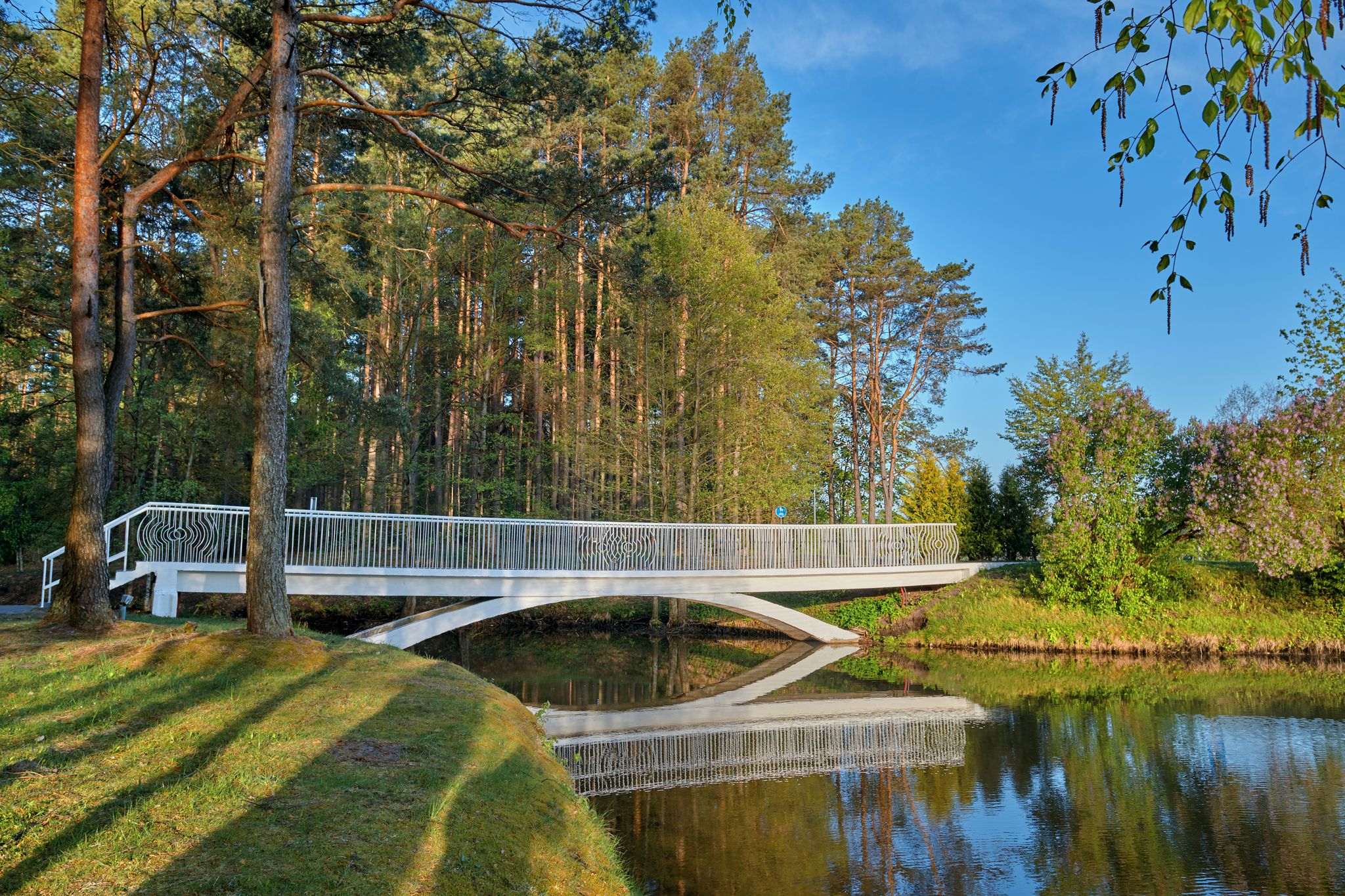 A pedestrian bridge near Lake Druskonis in the early morning from the southern side of Druskininkai, Lithuania - Image