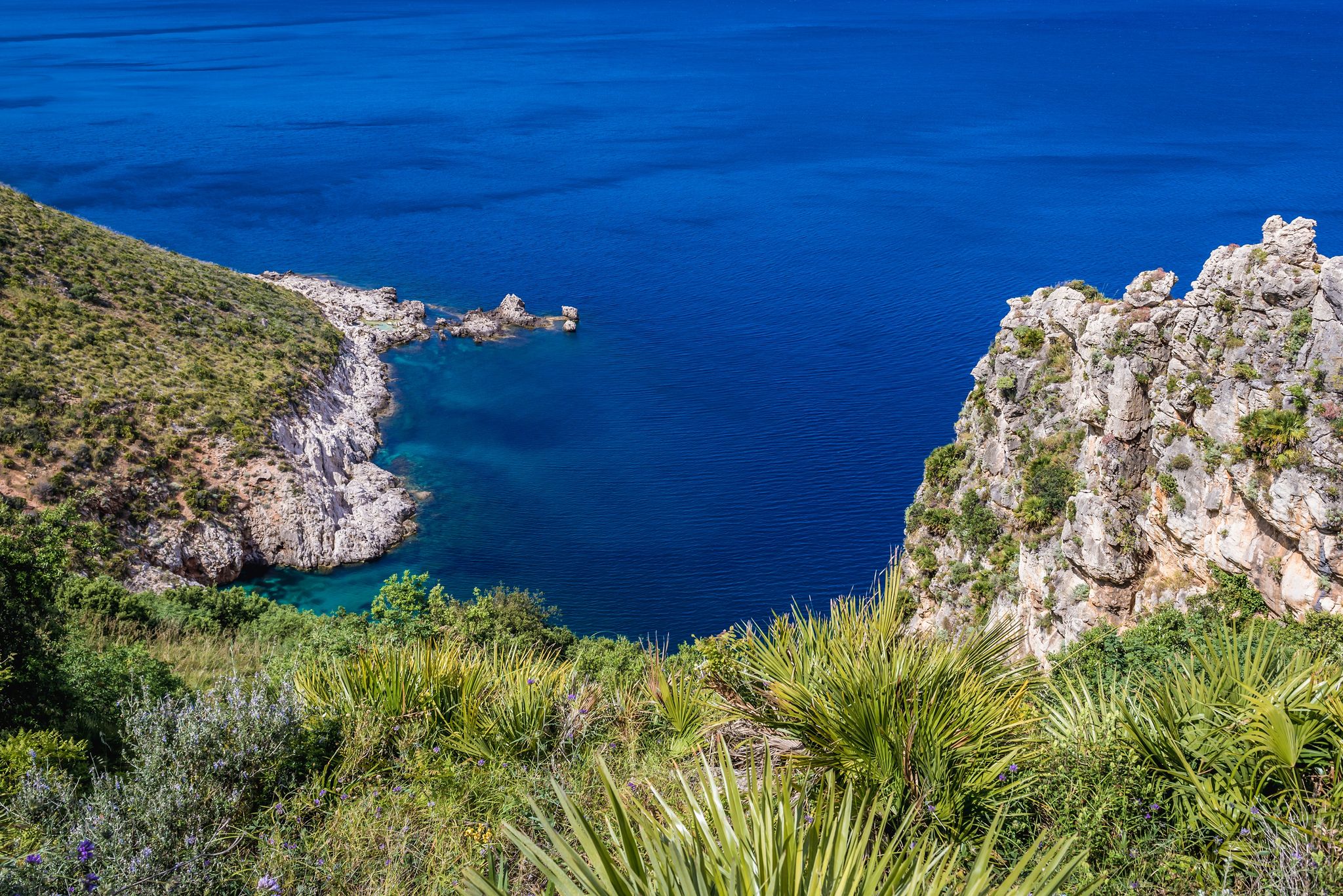 Punta Leone and Cala del Varo inlet in Zingaro natural reserve on the shore of Castellammare Gulf on Sicily Island, Italy.