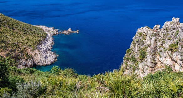 Punta Leone and Cala del Varo inlet in Zingaro natural reserve on the shore of Castellammare Gulf on Sicily Island, Italy.