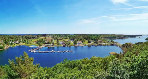 The view of the place name Gjerstadvannet at Tromøy, Arendal City, Norway. The Nice Natural. View over the sea and the small village name sandum from walk path from the mountain. local tourism Place.