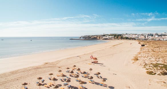 Aerial view of beautiful Meia Praia beach in Lagos, Algarve, Portugal at morning.