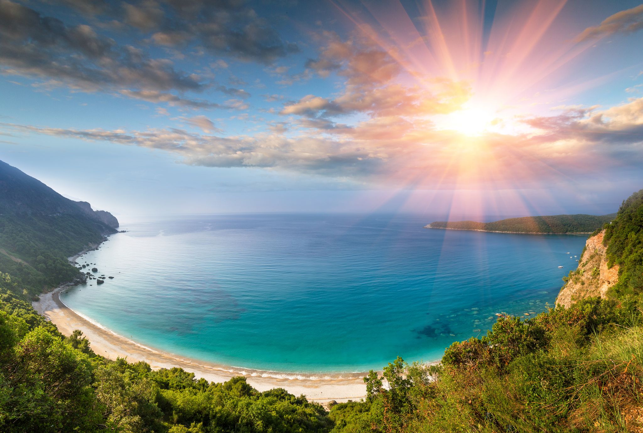 Photo of panoramic landscape of the rocky coastline sea and Jaz Beach at sunshine, Budva, Montenegro.