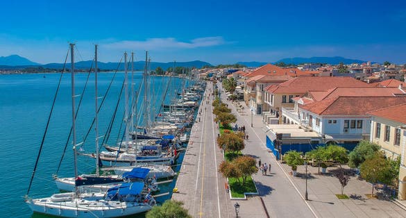 Photo of aerial scenic view of the famous Preveza city port and boats in spring time.