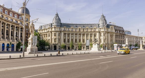 Photo of The beautiful University Square in the Lipscani district of Bucharest, Romania, on a sunny day.