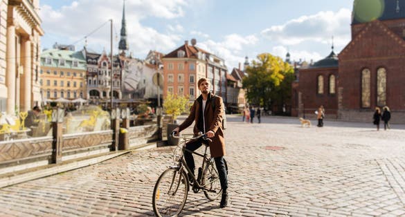 Young man riding a bike, Stockholm, Sweden.