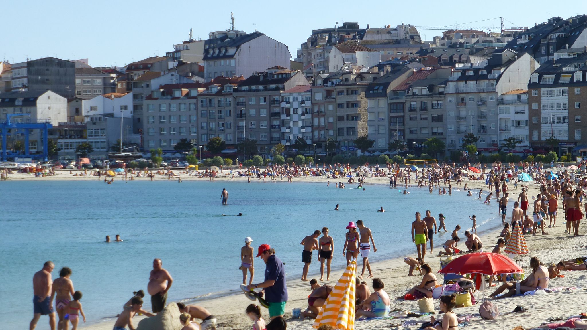 Photo of aerial view of an empty beach in Portonovo in the Ria de Pontevedra, Spain.