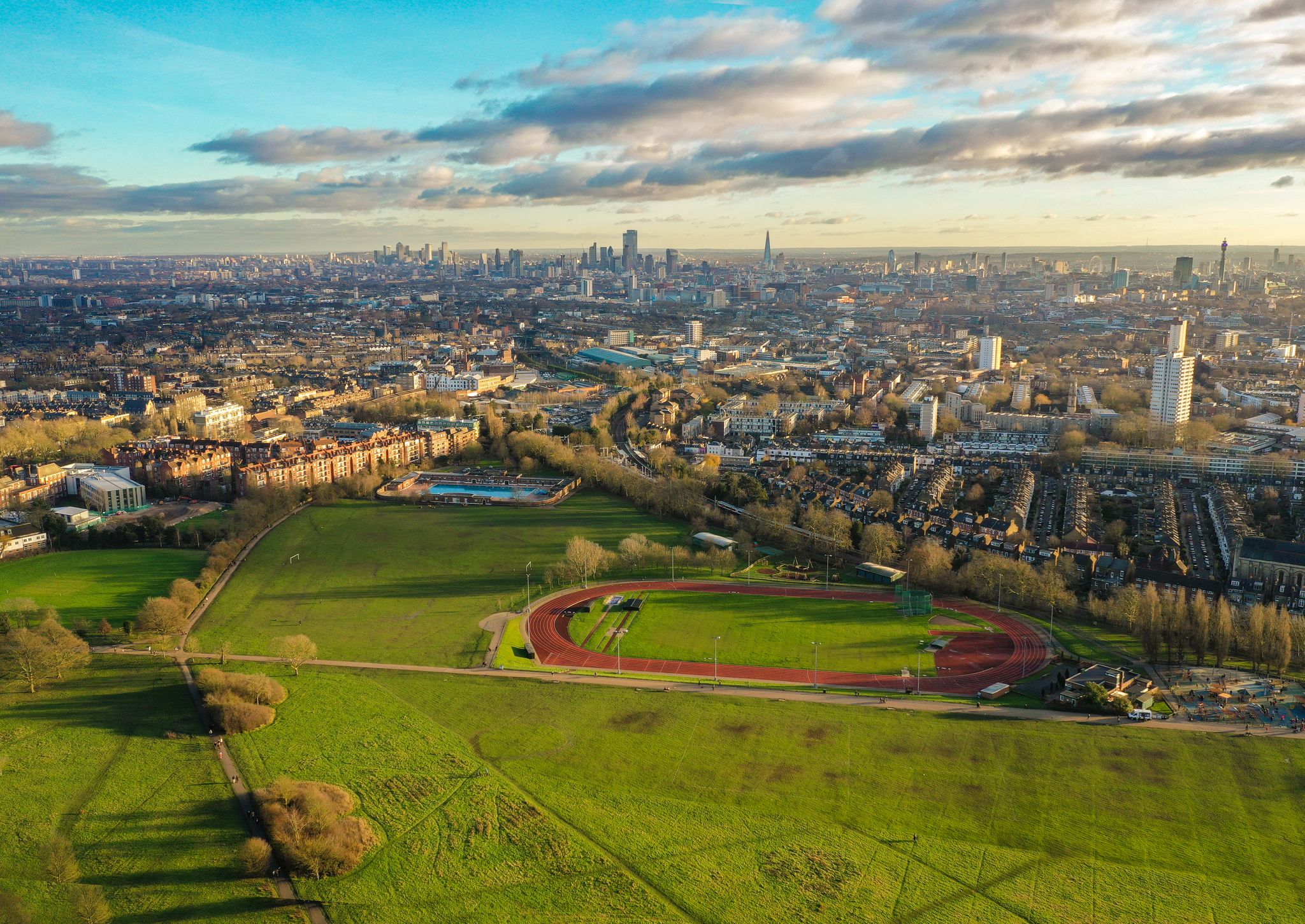 Photo of aerial view of Hampstead Heath, a grassy public space and one of the highest points in London, England.