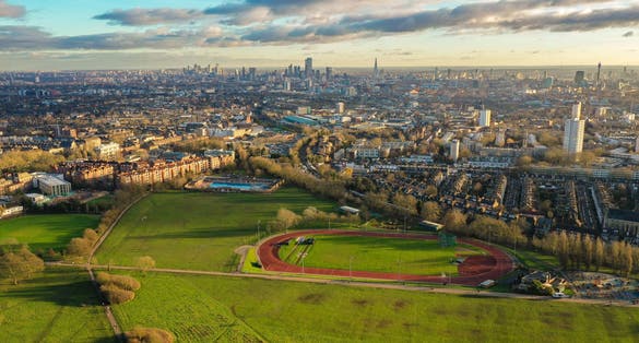 Photo of aerial view of Hampstead Heath, a grassy public space and one of the highest points in London, England.