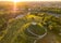 Aerial summer view of the Krakus Mound with amazing sunset view of the historical part of Krakow old town, Poland. Popular place to watch sunset in Cracow.