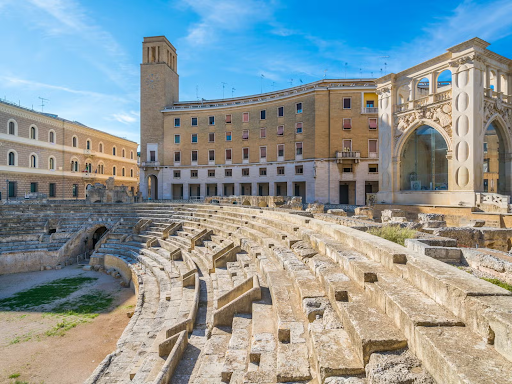 View of the Roman amphitheater ruins in Lecce’s Piazza Sant-Oronzo, a popular landmark in southern Italy..png