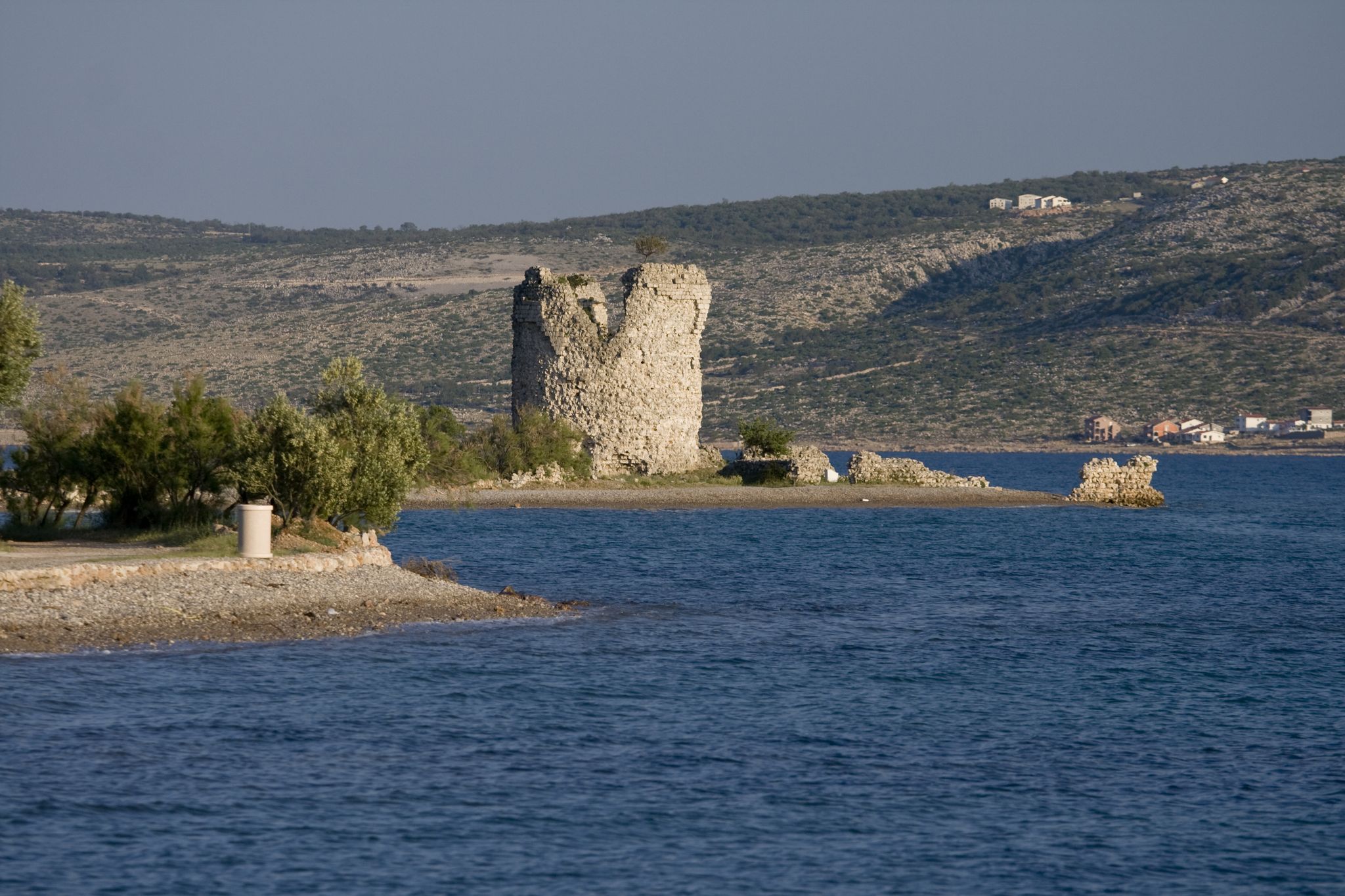 Photo of Večka kula tower and the blue coast, Croatia.
