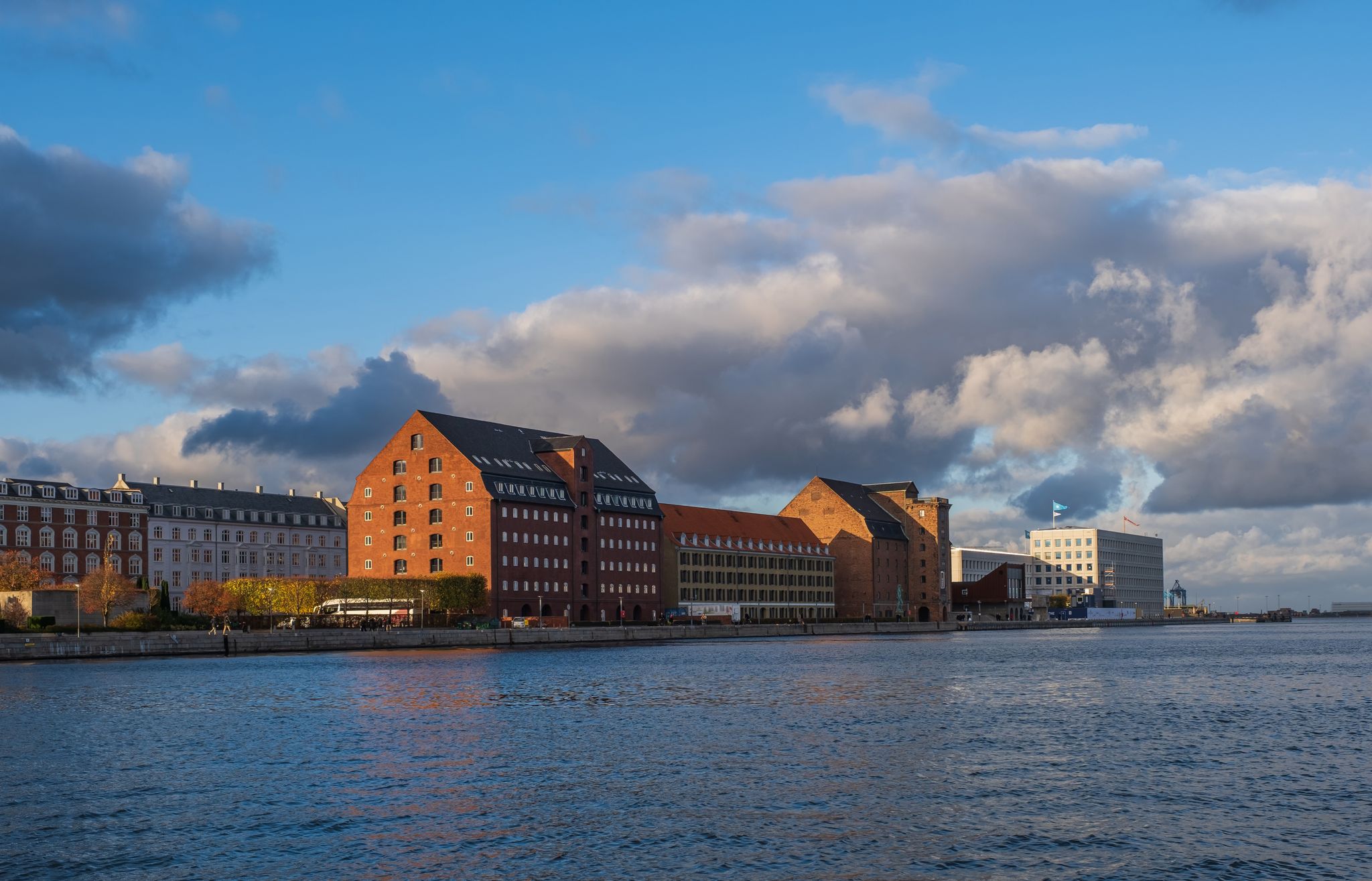 Photo of aerial view of Cultural centre North Atlantic House and buildings on the Kroyers Plads or Larsens Plads on harbour of Copenhagen canal, Denmark.