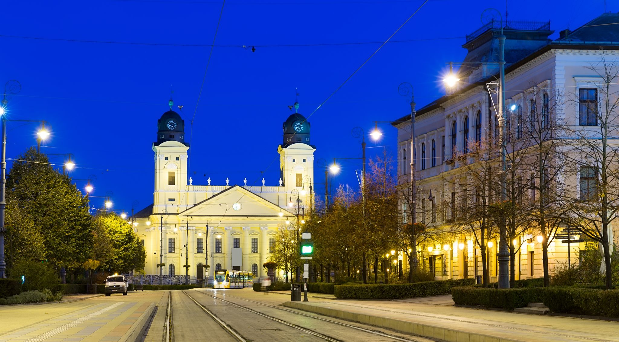 photo of view of Reformed Great Church in Debrecen city at night, Hungary.