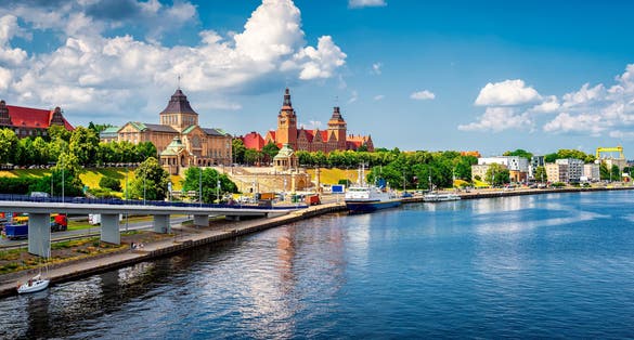 Photo of aerial view of Chrobry Shafts, moored ships and castle like buildings of National Museum and Passport Office, Szczecin, Poland.