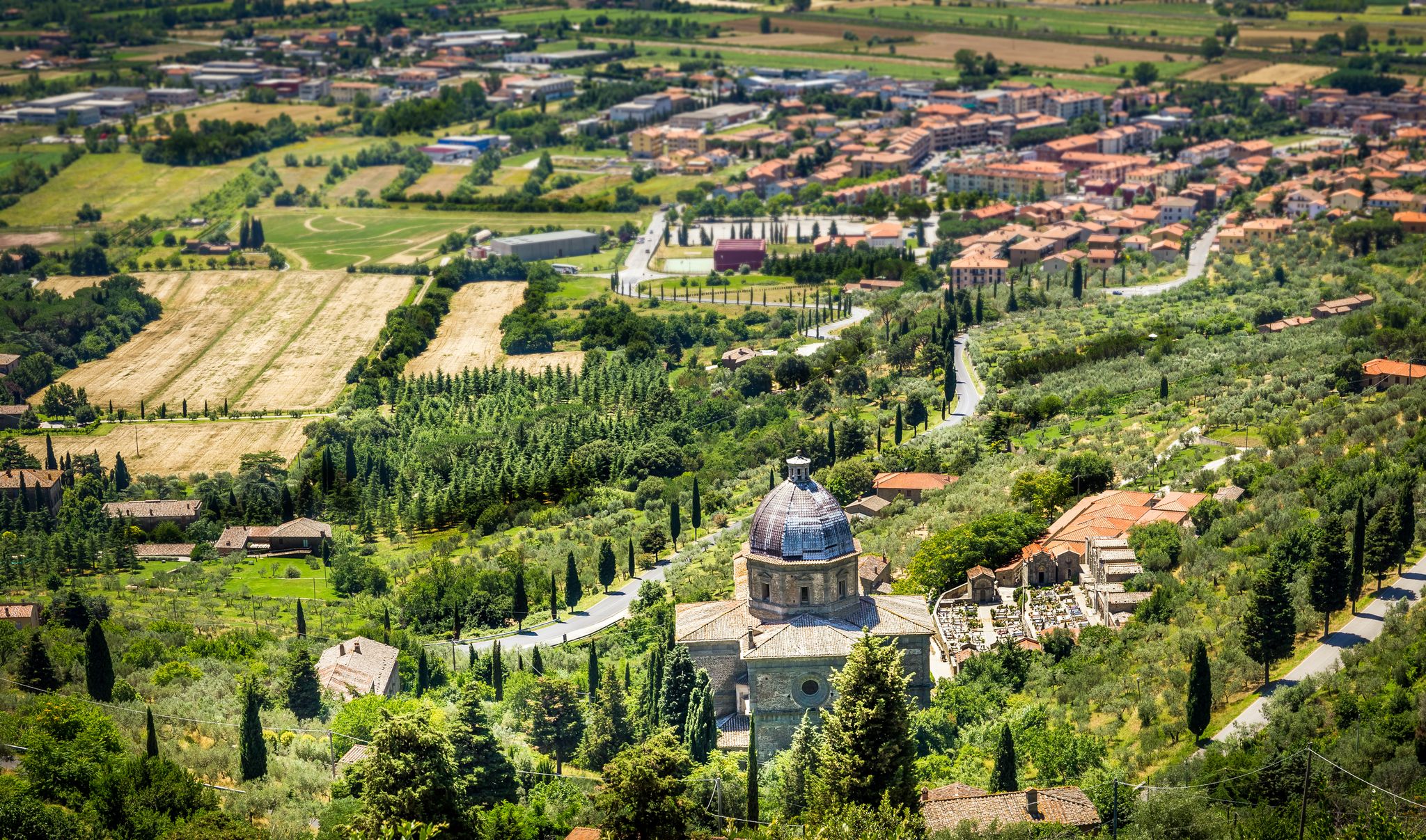Aerial view of green tuscan fields. A view from Cortona antique town.