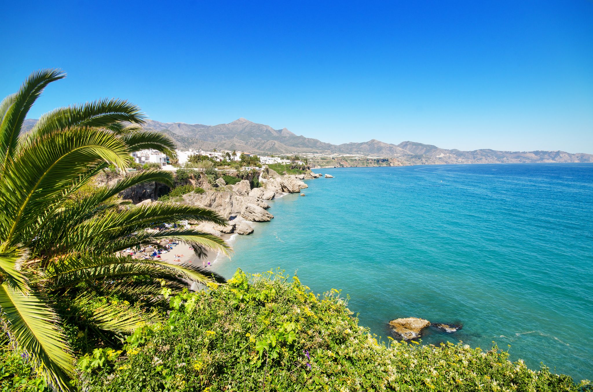 Photo of aerial view of beach in Nerja, Malaga province, Costa del Sol, Andalusia, Spain.