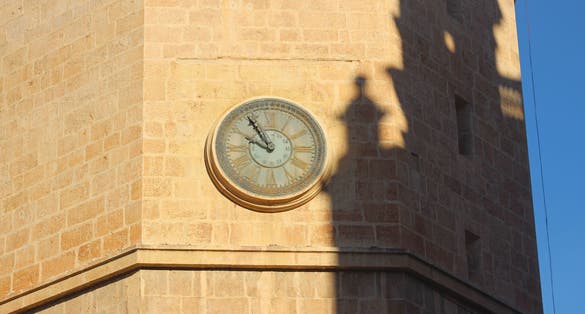 Photo of The clock of El Fadri and shadow of Cathedral in Castellon, Spain .
