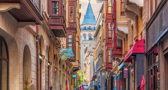 Photo of walls of the narrow turkish street by the Galata tower, Istanbul, Turkey.