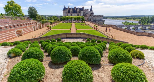 photo of beautiful garden and Chateau d'Amboise by sunny day, Loire Valley, France.