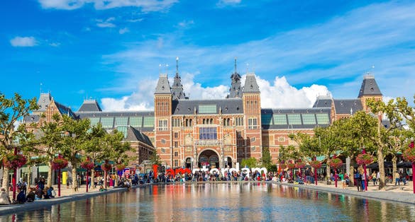 Photo of Rijksmuseum museum with Amsterdam words in front of it, Amsterdam, Netherlands.