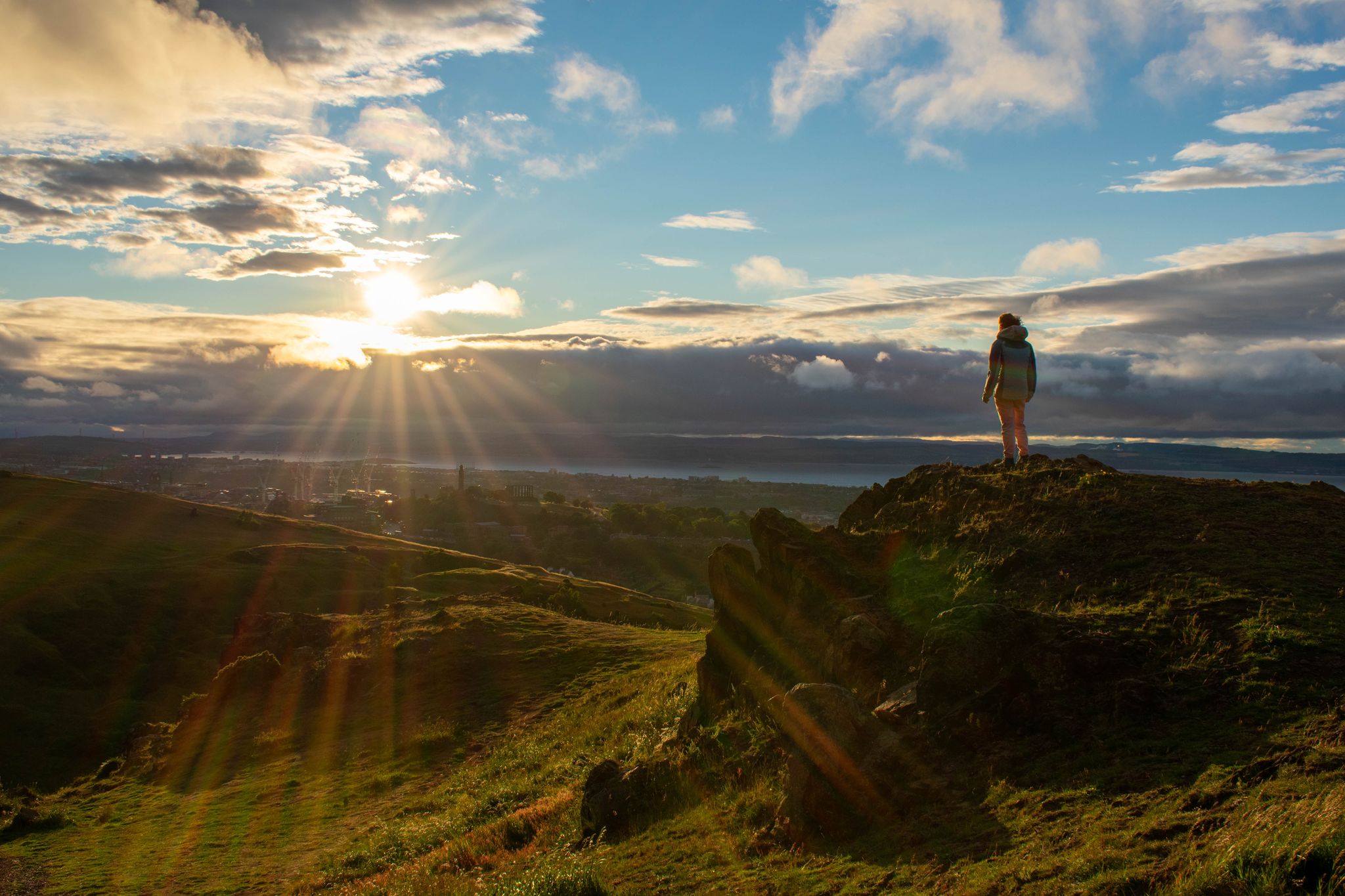 Photo of Standing atop a hill at Arthur's Seat, Scotland.