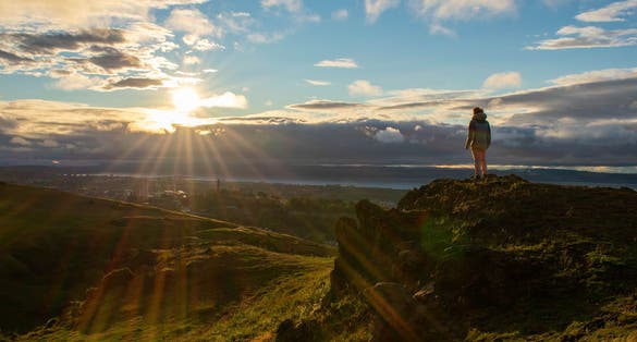 Photo of Standing atop a hill at Arthur's Seat, Scotland.