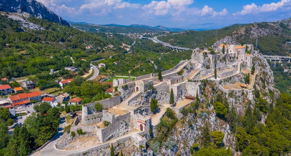 Photo of aerial view of Klis fortress near Split, Croatia.