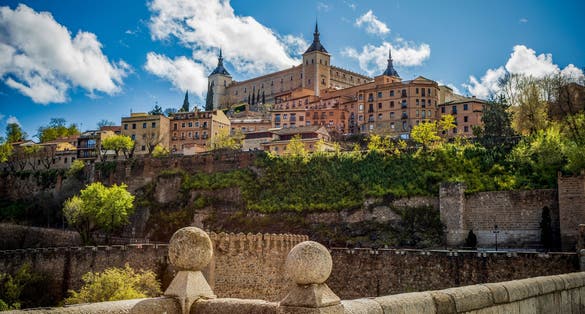 photo of view of View of Toledo, Castila la Mancha, Spain, world heritage city with the Alcazar high above on a bright day
