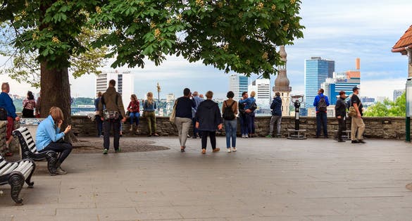 Photo of people in the Kohtuotsa Viewing platform, enjoying the views of the old town.