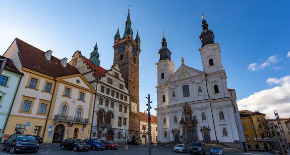 Photo of black Tower and Church of Virgin Mary's Immaculate Conception in Klatovy, Czechia.