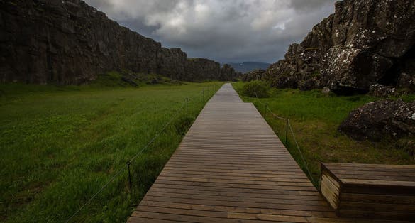 photo of Þingvellir National Park - Where You Walk Between Two Continents in Iceland, travel the world, waterfall and river .