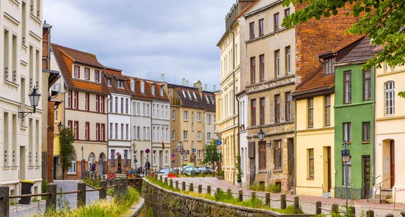 On the streets of Wismar old town. Colorful houses along the canal of Grube river, Wismar city, Mecklenburg-Vorpommern state, Germany