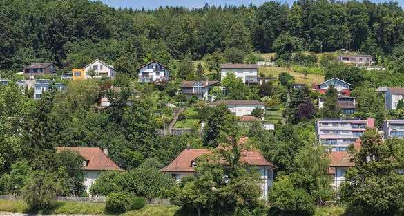 Photo of buildings of the town of Aarau along the Aare river in summertime, Switzerland.