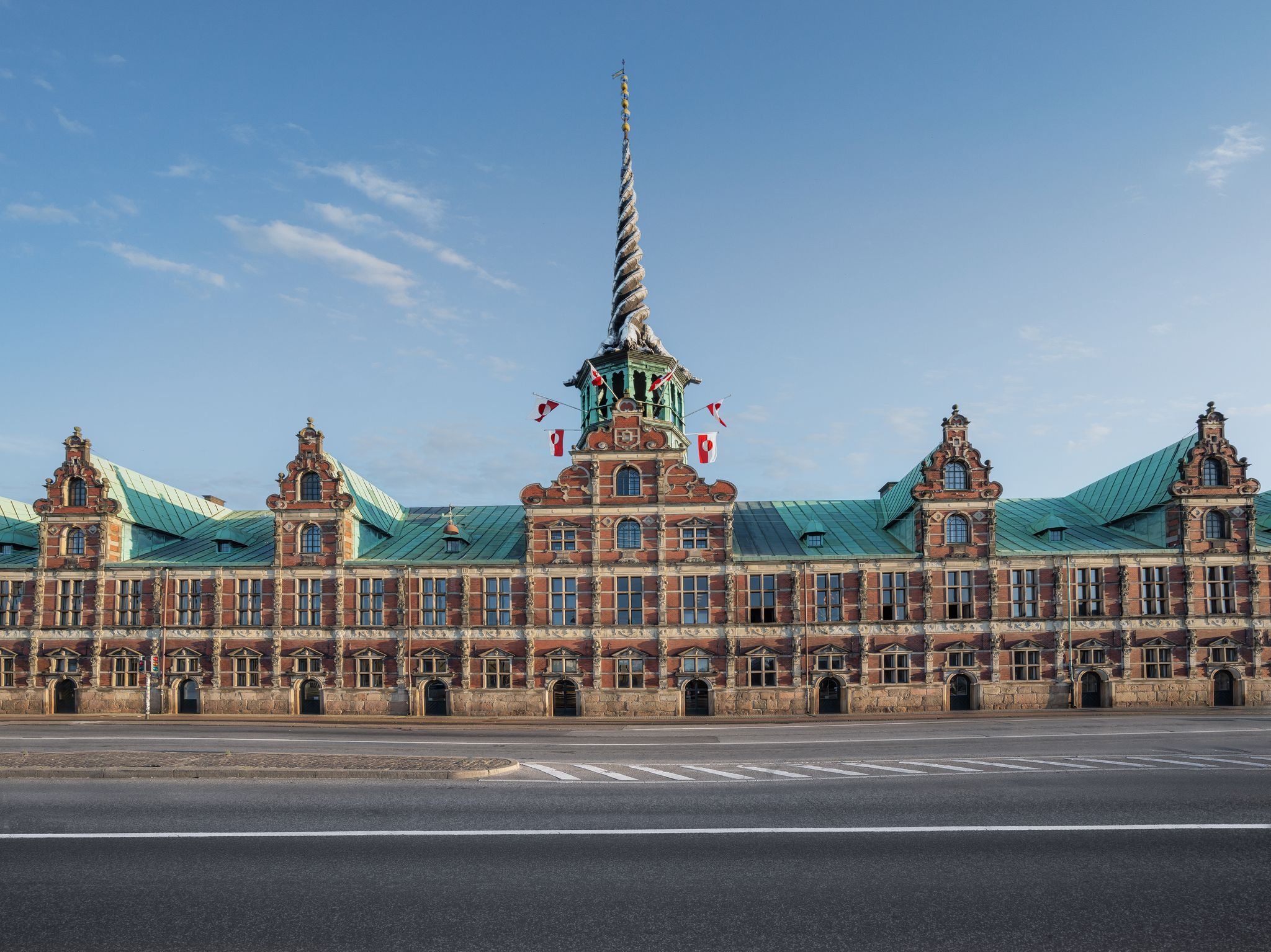 Photo of the Stock Exchange "Børsen" imposing, 17th-century, former stock exchange with a striking spire, historical place in the center of Copenhagen, Denmark.