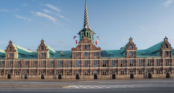 Photo of the Stock Exchange "Børsen" imposing, 17th-century, former stock exchange with a striking spire, historical place in the center of Copenhagen, Denmark.