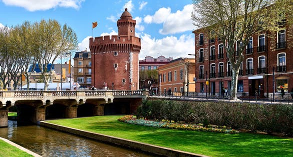 Photo of view to the Canal and Castle of Perpignan in springtime, France.