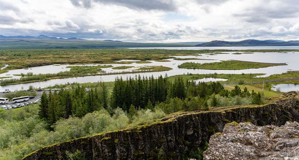 photo of Landscape of Thingvellir rift valley of the mid Atlantic ridge and Lake Thingvallavatn in Iceland .