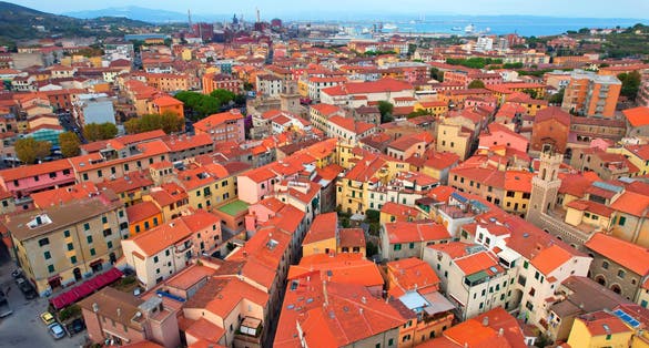 Photo of aerial view of the beautiful coastal town Piombino, Italy.