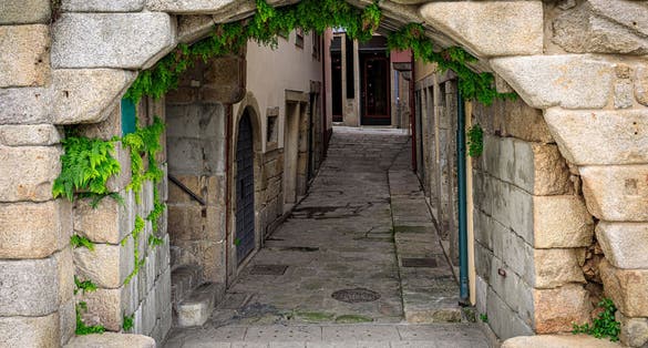 Photo of Postigo do Carvao, the only remaining gate in the 14th century Fernandine Walls around the city of Porto near Ribeira square and the Douro River.